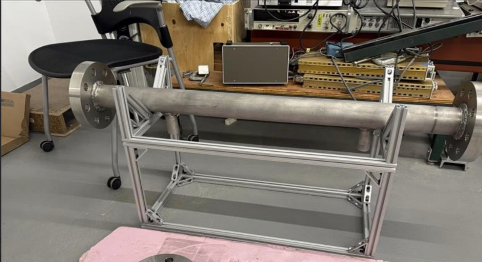 Fabricated pressure vessel mounted in an aluminum frame